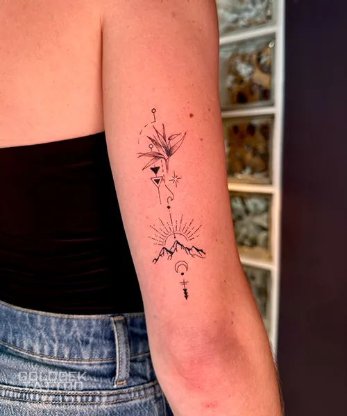 Fine line butterfly tattoos by Goldbek Tattoo